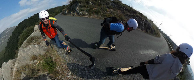 group of young people in electric longboard