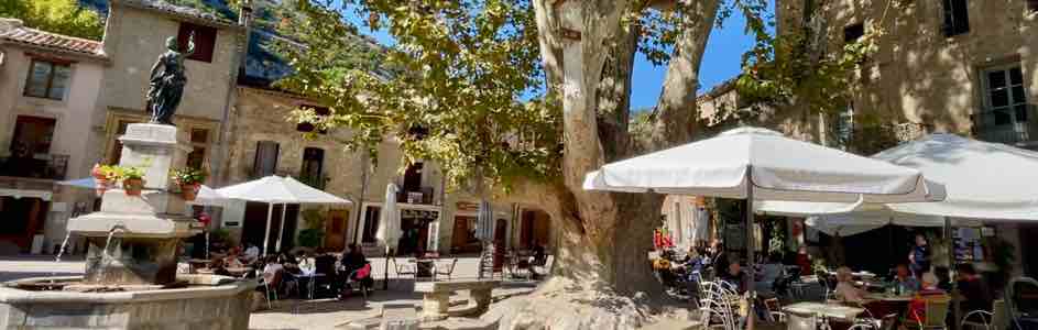 village square of Saint Guilhem le Desert with its cafes and restaurants